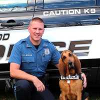 <p>Zoey and her partner, Maywood K-9 Police Officer Chris Nichols.</p>