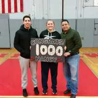 <p>Ruf and her travel coaches after hitting her 1,000th point.</p>