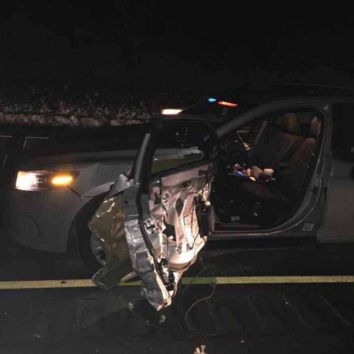 A car driven by a drunken driver slammed into a State Police cruiser on I-95 at the scene of a broken down bus.