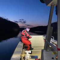 <p>Members of the Newtown Underwater Search and Rescue Team search for the missing hiker.</p>