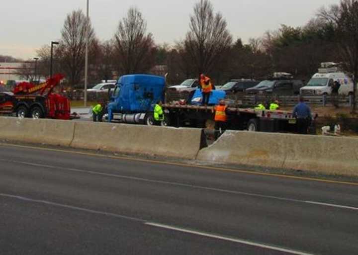 One of the rigs is hooked to a tow truck.