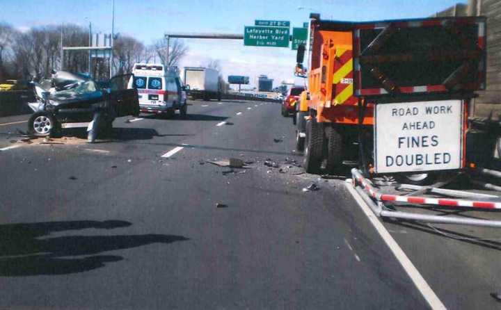 An SUV slammed into a DOT dump truck on I-95 in Bridgeport on Sunday morning.