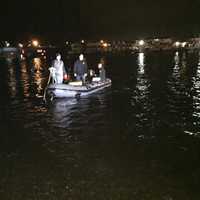 <p>First responders search the Saugatuck River after a car went into the chilly waters late Saturday.</p>