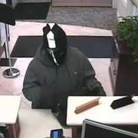 <p>The suspect in the robbery of the Fairfield County Bank in Wilton at the teller station on Feb. 24.</p>