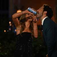 <p>Lanie Latsios gives Joey Graziadei some cheese whiz.</p>