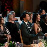 <p>Joey Graziadei seated next to Faith at the Golden Wedding.</p>