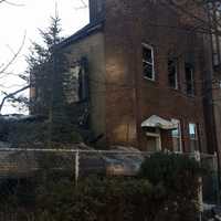 <p>Firefighters battled a two-alarm blaze that destroyed a Mount Vernon home displacing a dozen people overnight.</p>