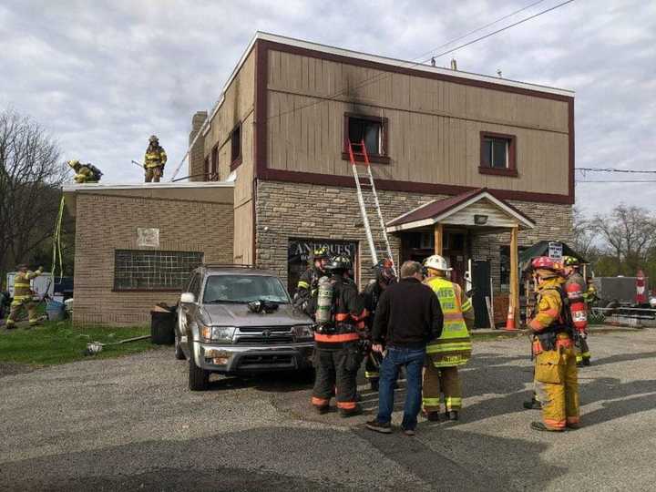 A Warren County woman was charged with arson in connection to a Monday morning fire above a flea market, authorities said.