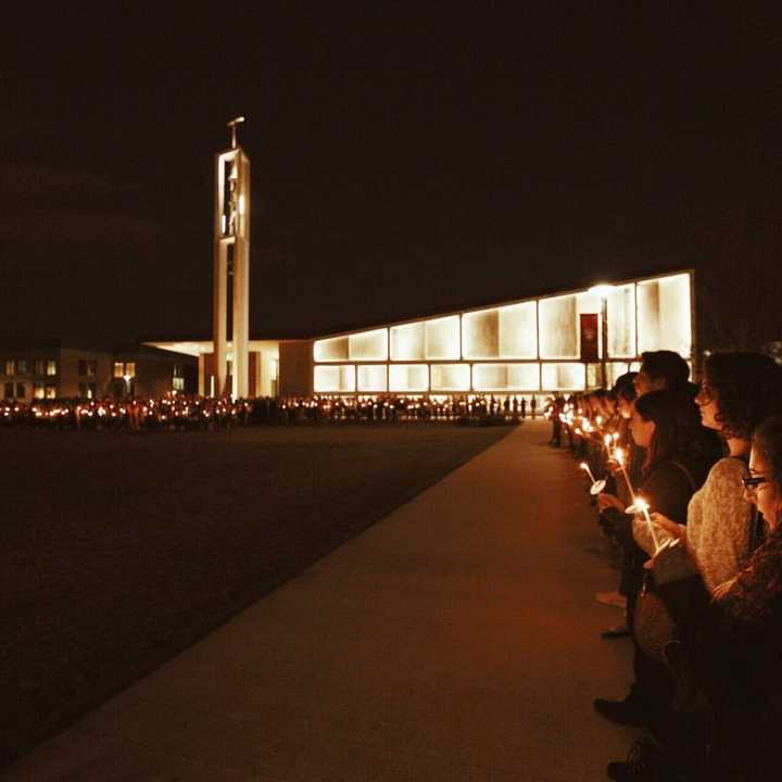 Students at Sacred Heart University hold a candlelight vigil Sunday night after the death of a classmate.