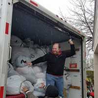 <p>Packing a U-Haul full of donations in Eastchester as part of a volunteer effort by Greater NYC Families for Syria.</p>