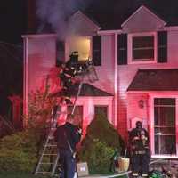 <p>Firefighters were met with heavy smoke from the second floor of the two-story home.</p>