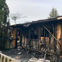 <p>A fast-moving fire tore through a Northampton County home Sunday night, displacing four adults and two children, authorities said.</p>