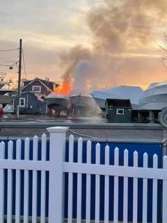 Multiple Agencies Race To Scene After Boat Near House Bursts Into Flames On Long Island