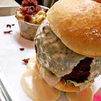 <p>The stuffed truffle smoked gouda mac n&#x27; cheese ball burger at Callahan&#x27;s in Norwood.</p>