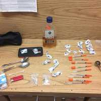 <p>Drugs and needles seized during a vehicle check.</p>