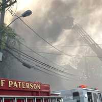 <p>Firefighters battle the smoky Temple Street blaze.</p>