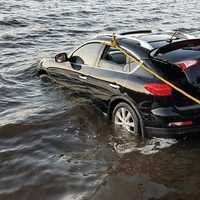 <p>Stevenson volunteer firefighters and a tow company pull a car out of Lake Zoar in Monroe on Wednesday.</p>