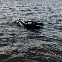 <p>The car begins to emerge out of Lake Zoar in Monroe.</p>