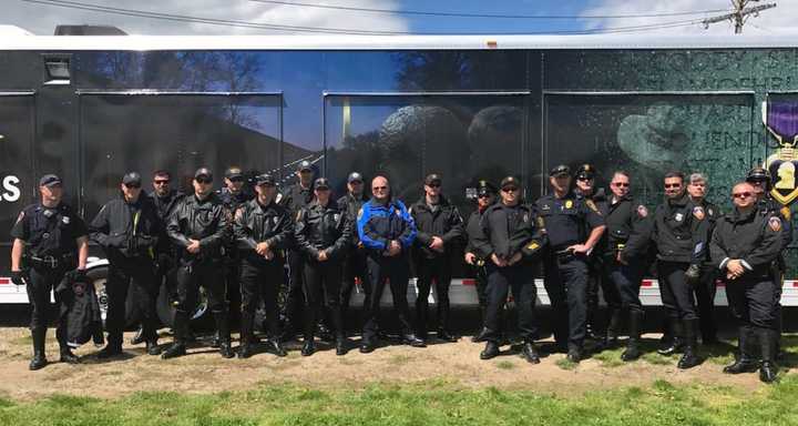 Westport officers join others from across the state to accompany the Wall That Heals from Sherwood Island State Park to Seaside Park in Bridgeport.