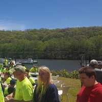 <p>Volunteers gather on the riverbanks during cleanup efforts on May 6.</p>