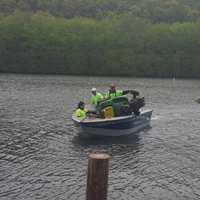 <p>Volunteers gathered trash from the Housatonic River on Saturday.</p>