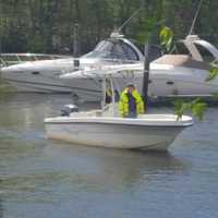 <p>Volunteers scan the Housatonic River for garbage.</p>