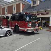 <p>Firefighters on scene of a car crash into the Riverside Bank in the Village of Fishkill.</p>