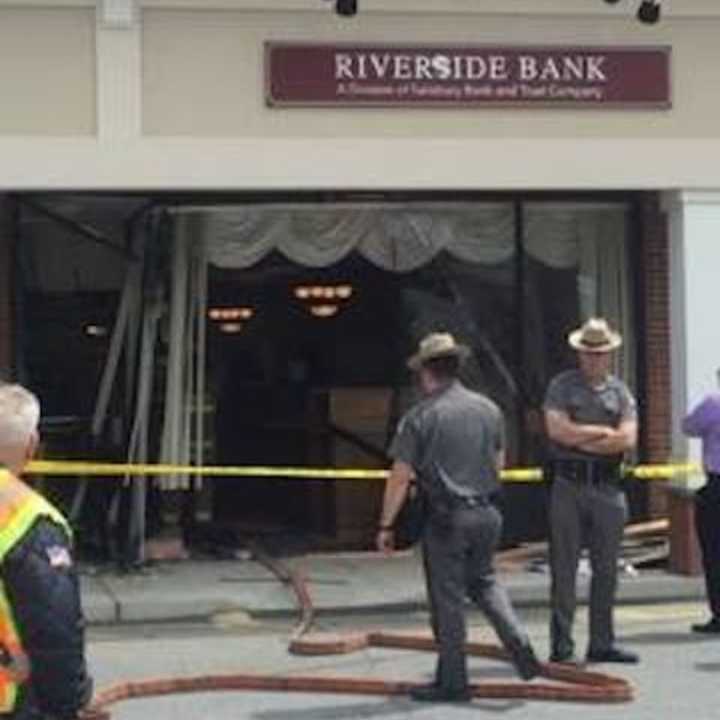 A car plowed through the front of Riverside Bank in the Village of Fishkill causing heavy damage.