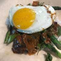 <p>&quot;Steak n Eggz&quot; from Eggz featuring Flat Iron Tikka, Asparagus, Cilantro, Spring Garlic, Jasmine Arroz, and Sunnyside egg.</p>