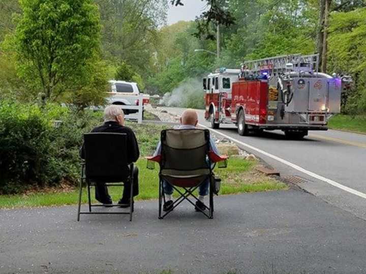 Firefighters work to restore power in Mahwah Saturday.