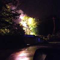 <p>A fire on a utility pole near the &quot;Graffiti Bridge&quot; in Brookfield lights up the sky late Saturday.</p>