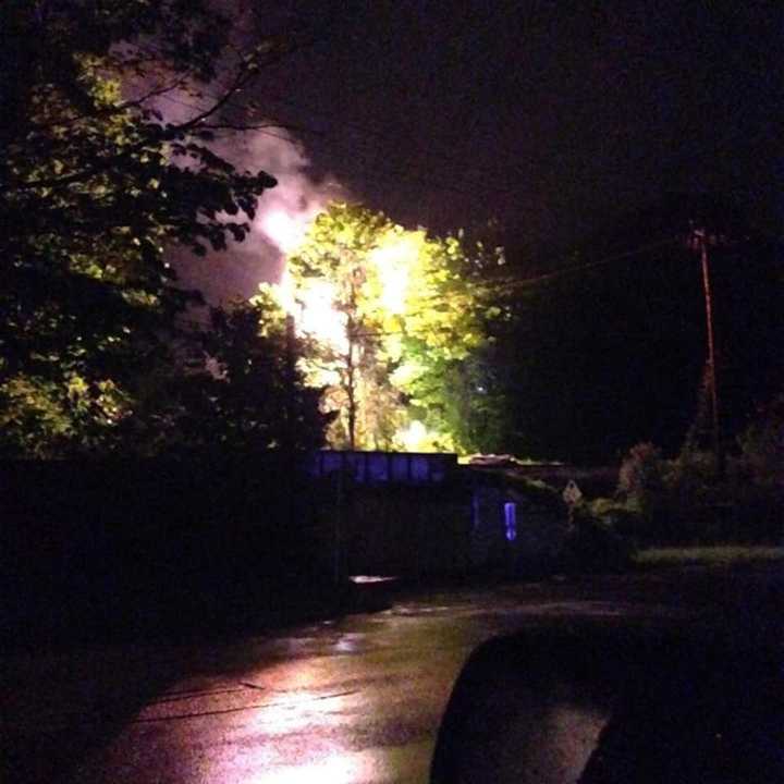 A fire on a utility pole near the &quot;Graffiti Bridge&quot; in Brookfield lights up the sky late Saturday.