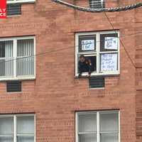 <p>The Hackensack woman apparently had taped signs to her windows.</p>