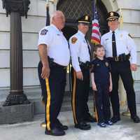 <p>Bergen County Sheriff Michael Saudino, far left, stands next to his son, an officer in Haworth.</p>