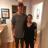 <p>NFL athlete Bradley Wing with Mary Garnett.</p>