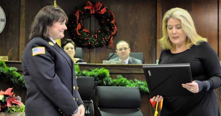 New Jersey Assemblywoman Holly Shepisi presents Kellie Goodell with a resolution on behalf of the state Legislature.