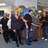 <p>New Rochelle Councilman Jared Rice with the staff and founders of A-Game Sports at the ribbon cutting ceremony.</p>