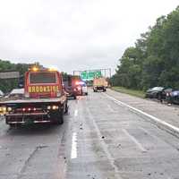 <p>Firefighters freed the driver of the overturned Nissan Sentra.</p>