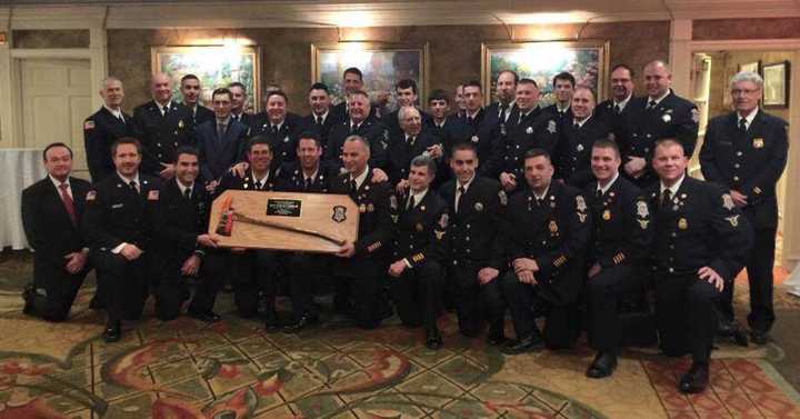 Wyckoff Protection Engine Company No. 1 with their inspection trophy.