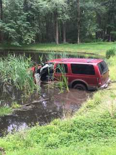 White Plains Man Charged With DUI After SUV Lands In Bedford Pond
