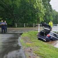 <p>Tow truck begins removing the SUV.</p>