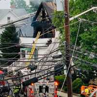 <p>Firefighters protected neighboring homes while dousing the East Clinton Avenue blaze.</p>