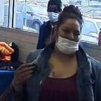 <p>A surveillance still of the wanted woman</p>