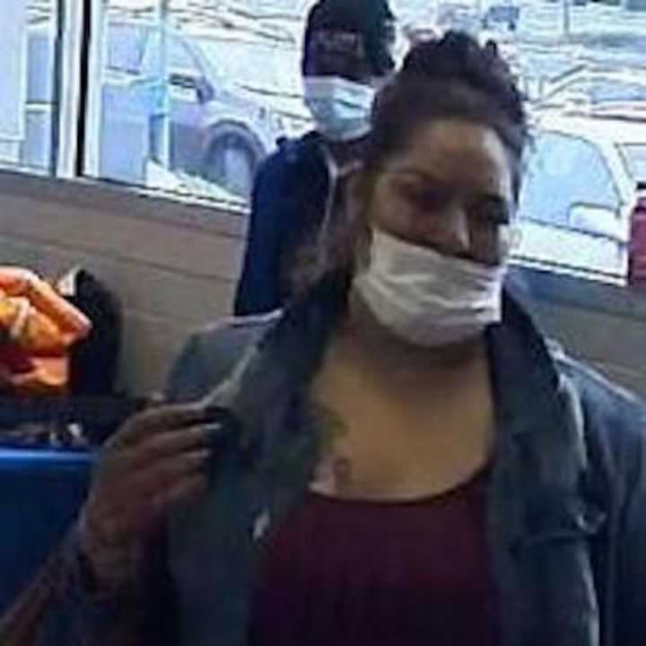 A surveillance still of the wanted woman