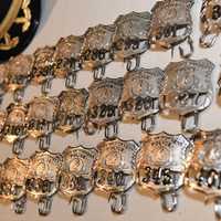 <p>The new, shiny badges waiting for the recruits.</p>