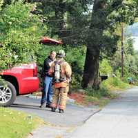 <p>Mahopac Fire Chief James Stasiak taking a report from firefighters.</p>