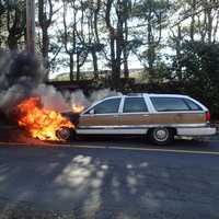 <p>Crews from the Westport Fire Department battled a blaze that broke out in the front end of a station wagon.</p>