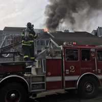 <p>Flames damaged a unit at the Rowayton Woods Condominiums on Wednesday afternoon in Norwalk.</p>