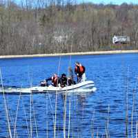 Photos: Two Rescued From Capsized Boat In Area Lake