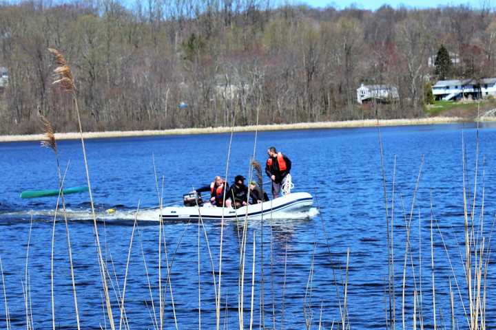 Photos: Two Rescued From Capsized Boat In Area Lake
